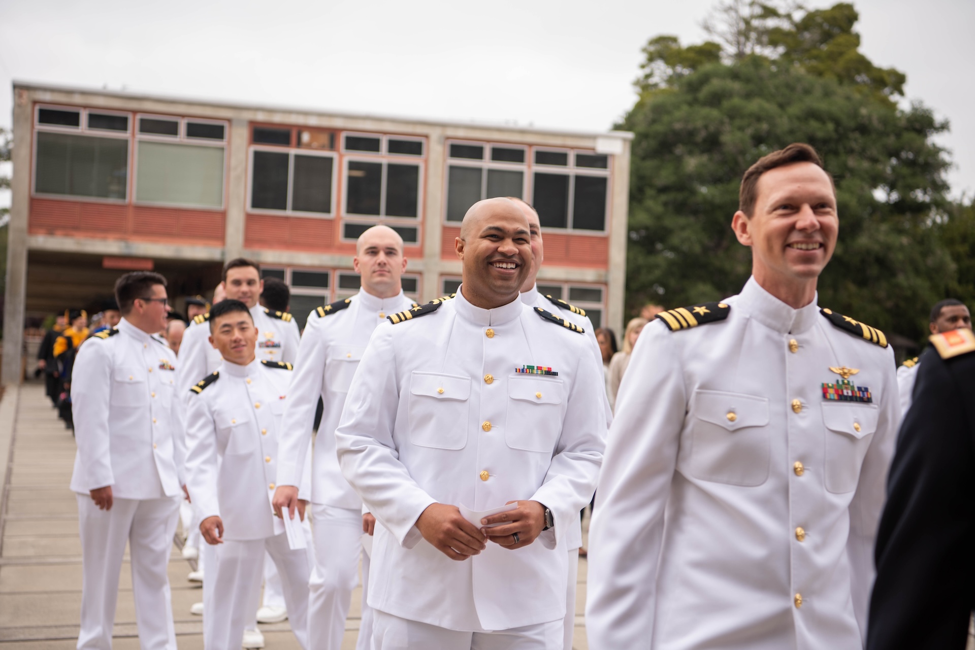 A group of NPS newly graduates posing for a photo