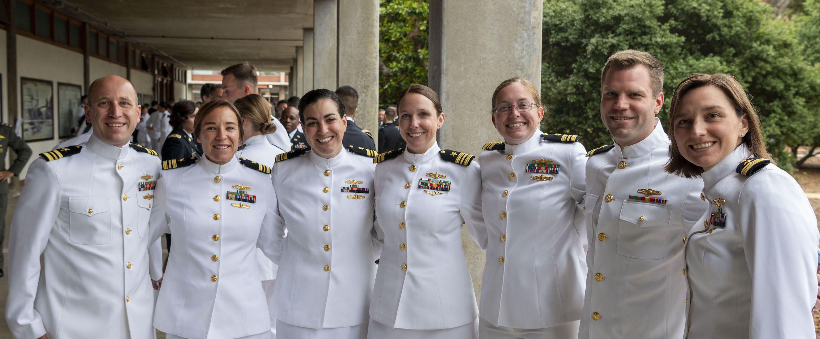 A group of NPS newly graduates posing for a photo